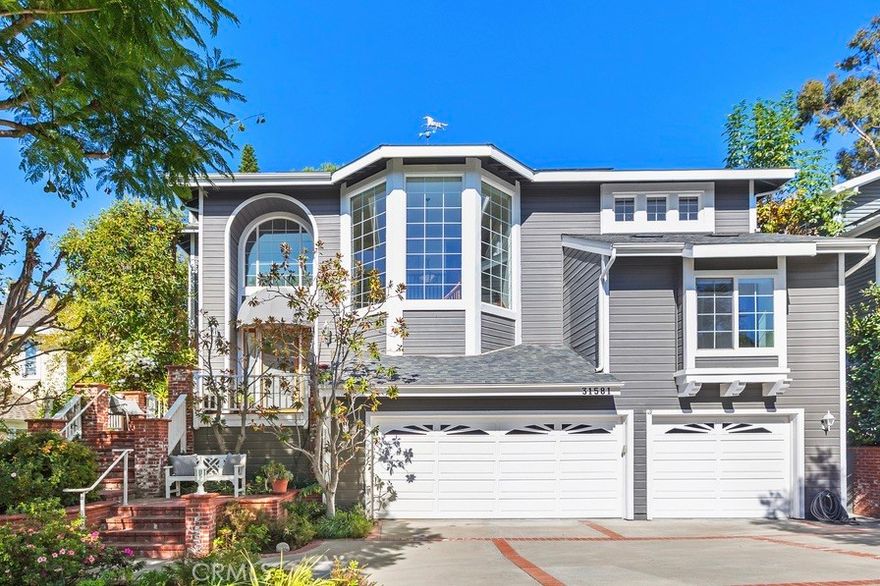 Offered for the first time, this custom 5-bedroom, 4-bath home is tucked within the Village of Coto de Caza, surrounded by mature trees and the natural tranquility this community is known for.
A bright and welcoming entry showcases 3 large front windows and a graceful curved staircase, setting an elegant tone from the moment you arrive. The formal living room features a handsome paneled fireplace and a stunning built-in 200-gallon salt water aquarium, complete with high-end filtration system.  This creates a one-of-a-kind focal point that brings life and calm to the space.  Just beyond is the large formal dining room offering the perfect backdrop for holidays and gatherings.  A main level office or bedroom with a full bath provides flexibility for guests or a private workspace.
The kitchen is generous in size, with an abundance of counter space, a large pantry, and views of the surrounding trees. It opens to the family room, where a classic brick fireplace adds warmth and character. From here, several doors lead out to the back newly built TREX deck, overlooking the peaceful garden and meandering path beneath mature oaks—a beautiful spot to unwind and enjoy the setting.
A back staircase connects the family room to the WhisperKOOL temperature-controlled WINE CELLAR with handcrafted cherrywood cabinetry and a tasting table, ample racking and storage for an extensive collection—perfect for the wine enthusiast or entertainer. The OVERSIZED 3 car garage has an extra DEEP design with extensive cabinetry and storage.
Upstairs, the primary suite features a brick fireplace, a walk-in closet, and another private deck overlooking the beautiful backyard. The upstairs laundry room includes a sink and built-in cabinetry for extra storage.  There are also 3 more spacious sized bedrooms with generous closet space, complete with en-suite and Jack and Jill bathrooms. 
Additional highlights include a FULLY paid 5.6 kW solar panel array providing significant energy savings.  
For an additional membership fee, you can join the Coto De Caza Golf & Racquet Club. This will allow you to take advantage of all of the amenities including an AWARD-WINNING 36 HOLE GOLF COURSE, sports club and pool, tennis, sports classes, restaurants, and so much more. Set in one of Coto de Caza’s most charming and established neighborhoods, this home blends comfort, thoughtful craftsmanship, and the serenity of its natural surroundings—offering a truly special place to call home.