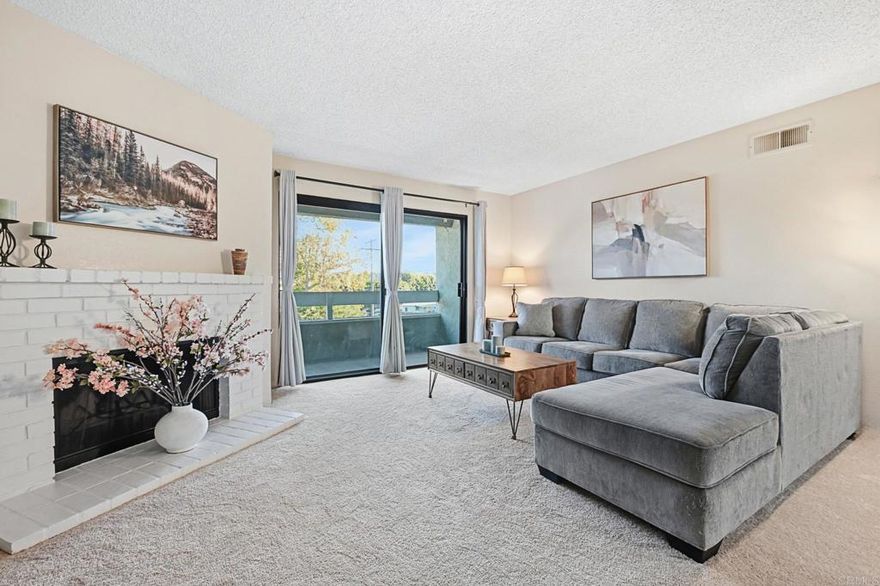 Bright & Beautiful Top-Floor Condo in a Gated Community! Welcome home to this light-filled third-floor retreat where comfort meets convenience. Step inside to an open living space featuring fresh new flooring and cozy carpeting throughout. The inviting living room centers around a charming white brick fireplace and opens through double doors to a spacious patio, perfect for morning coffee or evening relaxation. The galley-style kitchen offers granite countertops, newer appliances, a double sink, and a generous passthrough to the living and dining areas, keeping the conversation flowing while you cook. The spacious primary suite features a large closet and an ensuite bath with granite countertops and a newly updated tub insert, creating a relaxing private escape. Enjoy the ease of two assigned parking spaces and a well-maintained community with lush green spaces, a sparkling pool and spa, clubhouse, trash chute and laundry facilities, all within a secure, gated setting with controlled access. Centrally located near freeways, shopping, restaurants, and just minutes from Downtown Escondido, this home blends everyday comfort with a vibrant, connected lifestyle.