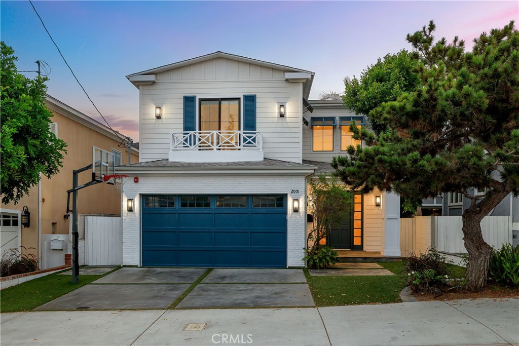 Nestled in the heart of the sought-after Tree Section, this 5-bed, 4.5-bath retreat (built in 2016) offers approx. 3,100 sq ft of elevated beachside living. Blending sleek design with relaxed coastal vibes, this home sits on a peaceful, tree-lined street just moments from top-rated schools, parks, and the beach. A newly refreshed exterior—complete with lush turf, vibrant landscaping, and a charming front porch—sets the tone for what’s inside. Step through the front door and you’re welcomed by soaring ceilings, wide-plank white oak floors, and sunlight pouring through oversized windows. The open layout is designed for connection and everyday ease, featuring a chef’s kitchen with 48” Thermador range, walk-in pantry, & oversized marble island, formal dining area + cozy living room with fireplace. Expansive bi-fold doors leading to a private backyard with built-in BBQ, gas fire pit & turf yard. The flexible floor plan includes a private downstairs guest suite—ideal for visitors, a home office, or gym—and a luxurious upstairs primary suite with vaulted ceilings, spa-inspired bath, and custom walk-in closet. Every detail of this home is tailored for laid-back California living with timeless style and functional design. Location is perfect with easy access to all that downtown MB has to offer within minutes, not to mention close proximity to LAX and all other South Bay adventures!
