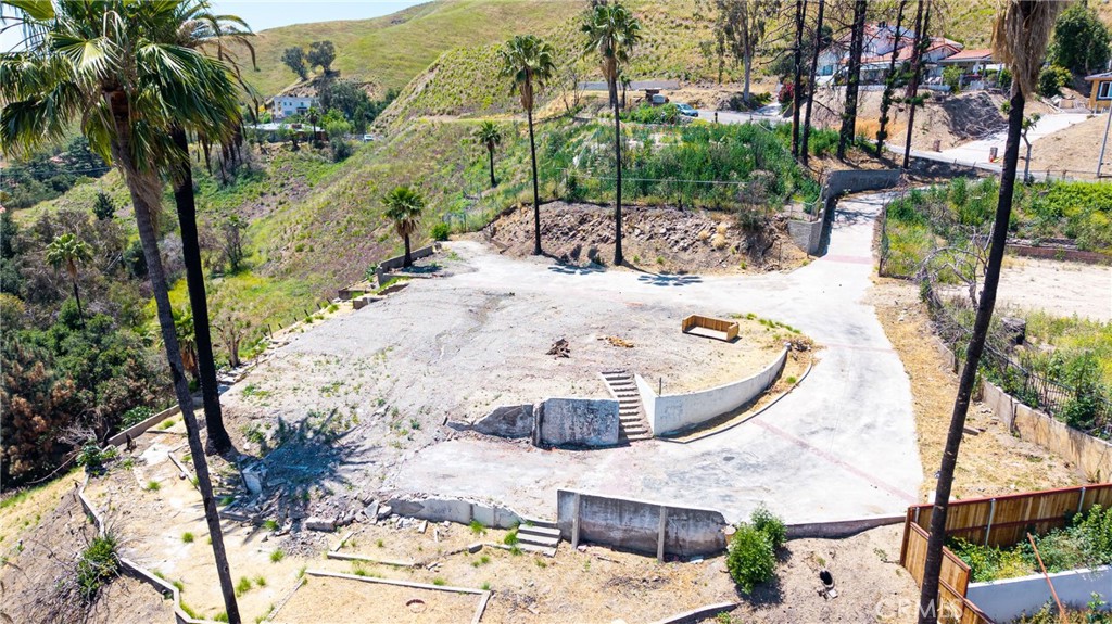Prime 1.15-Acre Lot with Panoramic Views in Shandin Hills – Utilities Onsite, Foundation Ready!Don't miss this rare opportunity to build your dream home in the highly sought-after Shandin Hills neighborhood of San Bernardino. This expansive 1.15-acre parcel is ready for development, featuring a flattened building pad, cement driveway, and the original foundation and retaining wall still intact—saving you time and money during construction. Enjoy sweeping views of the surrounding hills and city lights from one of the best vantage points in the area. All utilities are already onsite, offering unmatched convenience and value. The existing retaining wall qualifies this property for significantly lower property taxes, a huge bonus for long-term savings.Whether you're a builder, investor, or future homeowner, this property is a true gem in an established, quiet community with no HOA. Priced at $410,000, this lot offers a rare combination of location, infrastructure, and long-term financial benefit. Bring your vision and make this premium piece of Shandin Hills yours today!