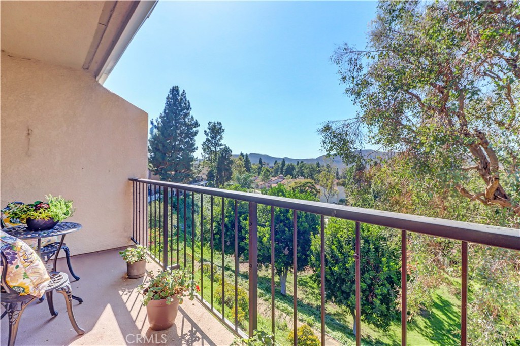 3rd floor "Sierra" condo with ELEVATOR access and view of Laguna Canyon! You'll love this great location with northwest orientation from the balcony to enjoy sunsets and cool breezes. The bedrooms face southeast for morning sun and nice bright outlook throughout the day. The beautiful views are framed with dual pane windows and plantation shutters. Spacious living/dining area and balcony for al fresco dining to enjoy the view. Kitchen features stainless appliances and window over the sink. Guest bath has large vanity area and tub/shower combo while primary bath houses dual sink vanity, walk-in tiled shower and closet organizers. Two nice sized bedrooms with good closet space. This condo has many original components (including the wet bar) but has been well cared for, located in a great spot and priced accordingly for the ability to make it your own or enjoy as is! Great location between Clubhouses 5 and 6. Clubhouse 5 features a lap swimming pool enjoying a gorgeous view and aquatic classes, hot pool, small drop-in fitness center, fitness studio and game room. Events are held at the large main lounge with stage and dance floor. Clubhouse 6 has a smaller pool open during the summertime and hosts many private parties and groups. Laguna Woods Village residents enjoy a 27-hole championship golf course, a 9-hole executive par 3 course, pickleball and tennis courts, lawn bowling, gyms, clubhouses, swimming pools, horse stables, gardening centers, artist studios, computer workrooms and classes + over 200 clubs and organizations.