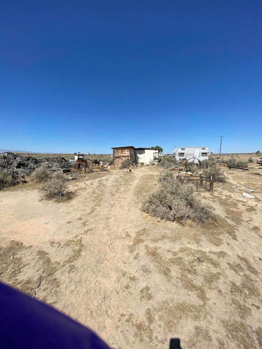 Adelanto, Ca.  2.5 ac M/L for sale.  267 Bella Vista Dr.  Land does have a existing Manufacture Home being given no value as it is a tear down/fixer.  So property had utilities.  Area of the high desert know for open space, quiet surroundings and dirt road access.  You own the land, No HOA restrictions.  A peaceful place to build your dream home with room for all your toys and pets.  Probate with full authority.  Property sold 'As-Is'.  Seller will make no repairs.  Seller and/or agent make no warranties.  Buyer to do their own investigations to satisfy themselves.  Seller has no title to the Manufactured home being left at property.  Seller has no obligation to move, improve or provide title.  Probate offer must have a 10% good faith deposit and proof of funds.