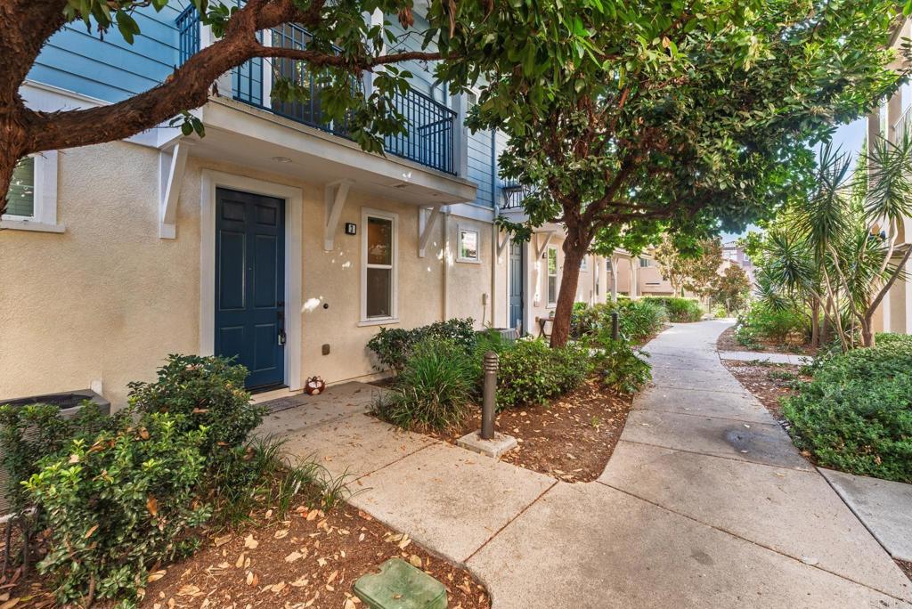 Welcome to the highly sought-after St. Cloud gated community, ideally located in the heart of the Rancho Del Oro neighborhood in Oceanside. This tri-level townhome offers a thoughtful layout and desirable features throughout. The entry level includes a full-sized laundry room with an extra storage closet and direct access to an oversized two-car garage, complete with a whole-house water filtration system. On the main living level, the kitchen features white cabinetry, a gas cooktop, reverse osmosis water filter, and a brand-new stainless steel refrigerator. The open-concept living area includes a cozy fireplace and access to a private balcony, perfect for relaxing or entertaining. The upper level offers a spacious primary suite with a walk-in closet and full bathroom, providing flexibility for roommates, guests, or those working from home. St. Cloud residents enjoy resort-style amenities including a junior Olympic swimming pool, spa, BBQ area, indoor gym, and a clubhouse with kitchenette available for private gatherings. The community is conveniently located within walking distance to award-winning Ivey Ranch Elementary School, Martin Luther King Jr. Middle School, and the beautiful MLK Park.