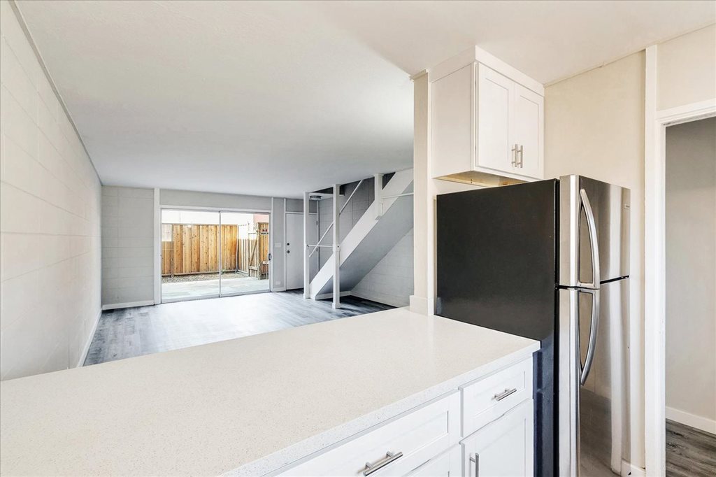 Gorgeously remodeled townhome in gated community! This 2 bed, 1.5 bath home features a completely remodeled kitchen with new cabinets, quartz counter tops, stainless steel appliances, dishwasher and built-in microwave. Fresh interior paint, new flooring throughout and private patio! Unit comes with 2 assigned parking spaces.