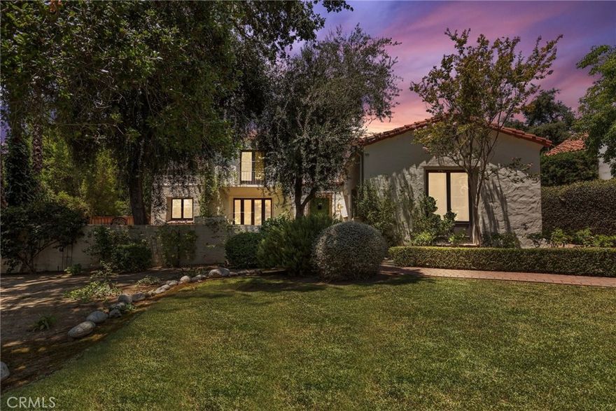 Welcome to 2297 Midlothian Drive — a masterfully reimagined Spanish Revival nestled in the foothills of Altadena. Originally built in 1928, this exquisite 5-bedroom, 4-bathroom residence has been thoughtfully expanded and remodeled to offer the perfect fusion of timeless architectural elegance and modern convenience.  From the moment you enter through the gated courtyard and step through the grand double doors, you are greeted by a warm and inviting foyer that sets the tone for the rest of the home. The formal living room features large window frames, a nod to its classic roots, and French doors that open to the serene front courtyard — ideal for seamless indoor-outdoor entertaining.  The formal dining room flows effortlessly into the updated chef’s kitchen, which boasts stainless steel appliances, abundant custom cabinetry, and a striking tiled backsplash with hand-painted Spanish accents. Whether you're hosting dinner parties or enjoying quiet family meals, this space is designed to impress. The main level includes a spacious guest bedroom, a full bath, and a dedicated home office — perfect for today’s work-from-home lifestyle. Upstairs, the luxurious primary suite offers a peaceful retreat with its spa-like en-suite bathroom featuring double vanities, a soaking tub, and a large walk-in shower. Three additional bedrooms, including a versatile bonus room that can serve as a fifth bedroom, media room, or studio, provide ample space for family or guests. Step outside to your private backyard oasis, complete with a covered patio, a sparkling pool, a built-in bar area, and a detached shed/workshop. The electric gated driveway adds both privacy and convenience, rounding out this exceptional property. Located minutes from the 210 freeway, North Lake Avenue shops, Eaton Canyon trails, and local cafes and parks, 2297 Midlothian is move-in ready and a rare find in one of Altadena’s most desirable neighborhoods.  Don’t miss your chance to own a piece of architectural history — beautifully restored for modern living.