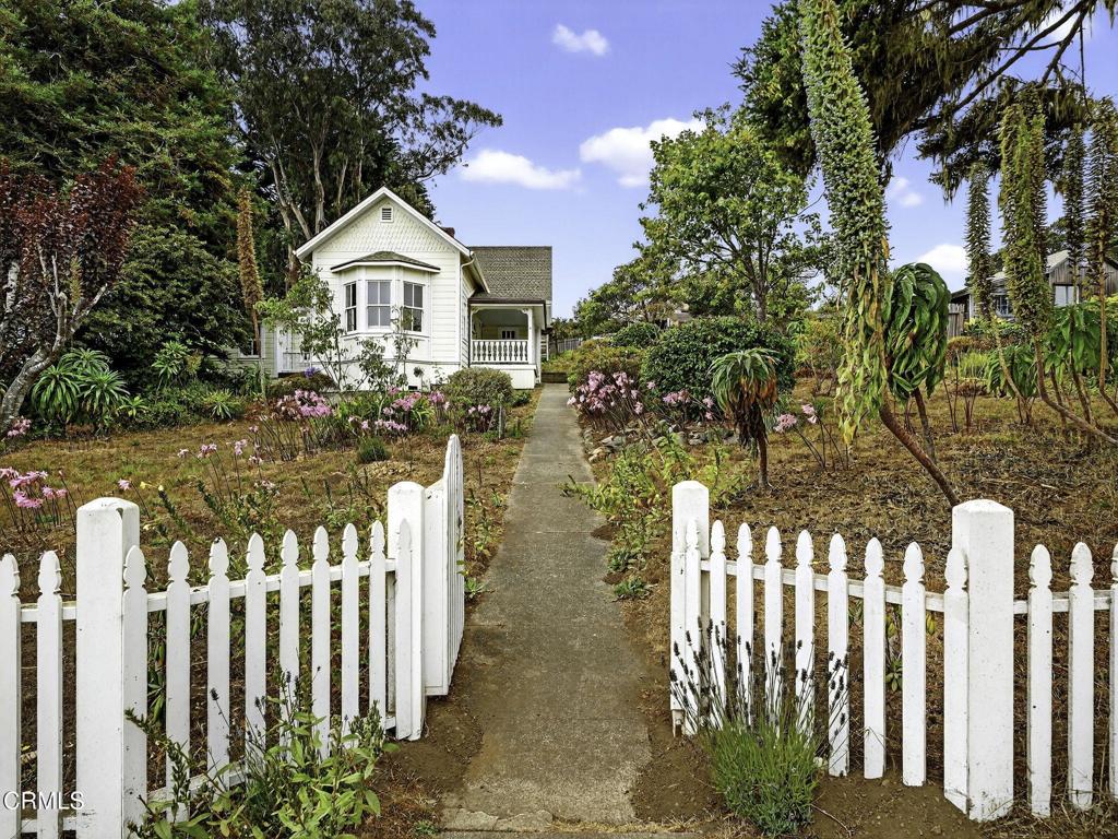 Perched above the Mendocino village sits the historic Jens Hansen House circa 1880 on .37+/- acres. The 3-bedroom, 1-bath home underwent an extensive restoration in 2009, while retaining its historic charm with original fixtures, including a working safe from the 1800s, and woodwork rarely found today. The renovation includes a perimeter foundation, all electrical and plumbing, wood windows and doors, a new roof, and reframing from the exterior to preserve the old-growth redwood interior. Custom-milled siding to match the original style, and much more. The only thing left is to add the finishing touches to the large kitchen. The spacious property features a separate carriage house with stunning views, making it a great spot for guests or an artist's studio. There are also historical photos of a water tower that may be able to be reconstructed with approval. Conveniently located to shopping, fine restaurants, beaches, and coastal activities while having privacy and a quiet setting.