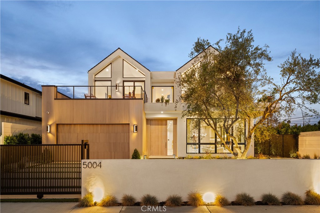 Welcome to The Enfield, a new construction Scandinavian-inspired estate in one of Encino’s most desirable neighborhoods. Spanning approx. 5,200 sq ft, this refined residence includes a private 1-bed ADU with its own entrance.
Defined by minimalist architecture and organic materials, the home features soaring ceilings, smooth plaster walls, and a striking spiral staircase that serves as an architectural showpiece. Throughout the home, beautiful wide plank French oak wood flooring adds warmth and elegance, flowing seamlessly from room to room on both levels.
At its heart lies a custom-designed kitchen with an oval-shaped Quartzite island, Quartzite countertops, premium Thermador appliances, and custom white oak cabinetry, all opening to the backyard through doors.
Outside, enjoy a sleek smart-controlled pool, spa, built-in BBQ, and manicured grounds designed for effortless entertaining. Built-in surround sound speakers create a seamless audio experience throughout, while the home is pre-wired for a comprehensive security alarm system, including both interior and exterior surveillance cameras and alarm integration.
A fully outfitted laundry room offers a washer and dryer, custom cabinetry. The spacious two-car garage includes EV charging capabilities both inside and just outside the garage, catering to modern living.
The living room is anchored by a slatted marble fireplace. The private office offers a quiet space for focus and can also serve as a bedroom. Baths feature hand-cut tiles, Venetian plaster, and luxurious finishes throughout.
The luxurious primary suite features a sitting area, impressive walk-in closets, stone fireplace, and a 300-square-foot balcony. The spa-like bath includes a large walk-in shower and timeless, elegant finishes.
Additional features: solar panels, three-zone HVAC, and smart home system. The private ADU mirrors the design quality of the main home, complete with its own kitchen, bathroom, and living space, ideal for guests, in-laws, or rental income.
Encino has to offer, The Enfield is a true statement of modern luxury, design, and comfort in the heart of the Valley.
Welcome home.
