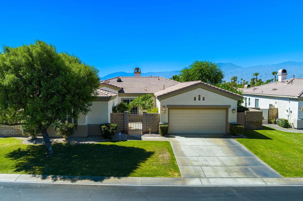 Located in the desirable gated community of Esplanade, this 5-bedroom, 3-bath home includes a detached casita, offering the perfect space for guests, a private office, or a flexible retreat. Inside, you'll find a spacious open concept layout, fresh interior paint, tile flooring throughout, and a well-equipped kitchen that flows into the main living area, ideal for entertaining or relaxing with family. The primary suite features an en-suite bath and a walk-in closet. Step outside to an expansive backyard with stunning south-facing mountain views, complete with a covered patio that offers both privacy and a peaceful setting for outdoor dining, lounging, or entertaining. Additional highlights include solar attic fans for improved energy efficiency, an epoxy coated garage floor with built-in cabinets and shelving for ample storage, and a charming gated front courtyard that adds curb appeal and security. Esplanade is a beautifully maintained gated neighborhood just minutes from world class golf courses, shopping, dining, and the charm of Old Town La Quinta. Don't miss your chance to own a move in ready home in one of La Quinta's most sought after communities. Schedule your private tour today.