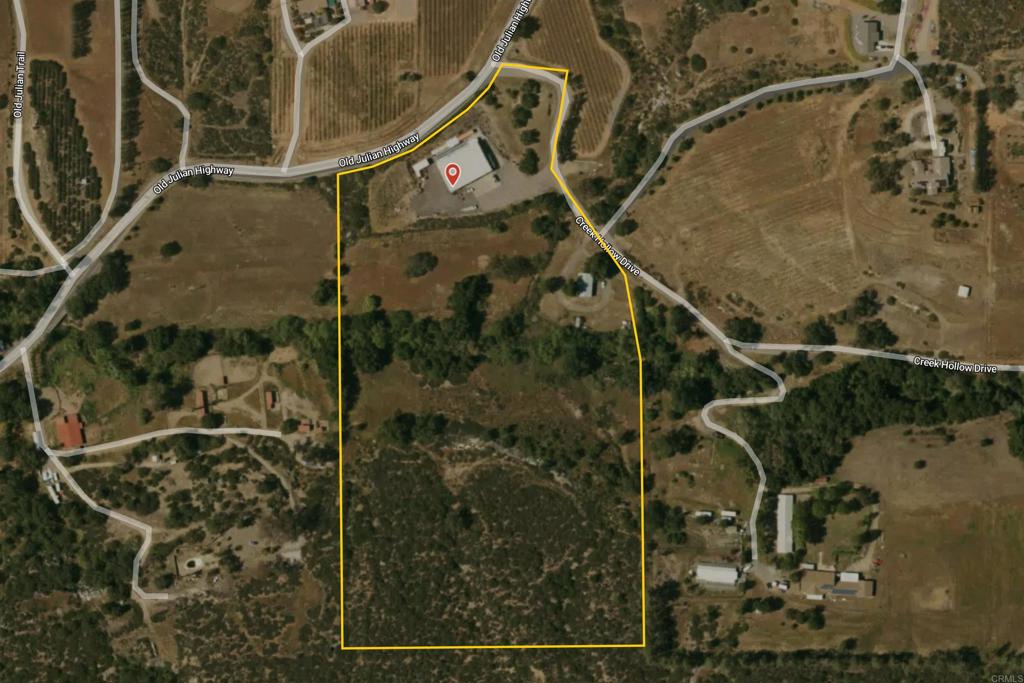 In an extremely desirable area of Ramona, we offer 15.92 acres zoned A72 with an Animal "O" Designator. The property was formerly developed for the purpose of processing honey and honey storage. The 7,000 sf Steel Warehouse measures 70' x 100' with an 18' ridge line, 6" concrete slab and walls and ceilings that are fully insulated. There is 200 amp service (3 phase available) 220 volt electric / propane. 12' wide x 14' high steel roll up door, bathroom with shower and small office area. The warehouse has its own separate septic system apart from the residence. Adjacent to the warehouse structure are two 8' x 40' and one 8' x 20 Seatrain Containers that convey with the sale. Existing residence is a 2+ bedroom/2 bath Manufactured home 48' x 28' (1,296 sf). A water well, 10,000 gallon water storage tank and three electric meters are a part of the property. All of this on just 6 of the 15.92 acres. If you cross "Wash Hollow Creek", you'll find approximately 10 more acres ready for future development.....Home, pastures, barns etc.