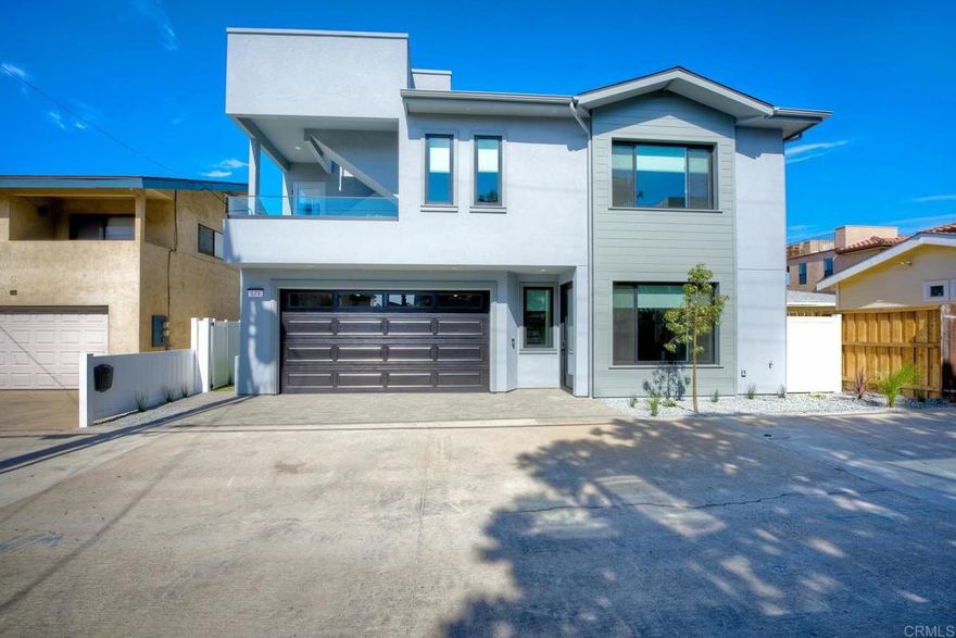 Be the 2nd family ever to occupy this beautiful 3 bed 2.5 bath home just 1/2 block to the beach. 10 foot ceiling, large 2 car attached garage, private fenced yard, laundry room with stackable washer and dryer. Gorgeous kitchen with top of the line finishes, open concept to great room with cozy gas fire place. White water roof top deck views to witness IB's spectacular winter sunsets.  NO HOA, no shared walls, detached private alley access.