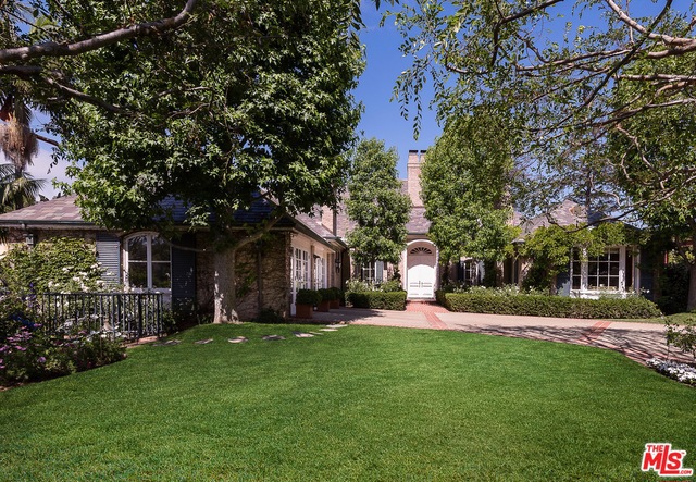 Classic Georgian Estate in coveted Brentwood Park. Situated behind gates ensuring privacy, surrounded by enchanting gardens, this 5 bedroom,7 bath home features enormous public rooms w/ wood floors, high ceilings & views to the spectacular rear gardens. Opening through French doors to the rear patio, yard & pool, the stage is set for large scale entertaining. Enter through an elegant front hall into the formal living room w/ fireplace & spacious formal dining room. There is a paneled den/library w/ fireplace & views of the front gardens. The cook's kitchen provides Viking stainless appliances, a Char-Glo Grill & a Garland convection oven. The butler's pantry provides beautiful lighted shelves for glassware, ice maker, sink & refrigerator. The master suite includes a fireplace, sumptuous marble bath, enormous walk-in closet & two separate sitting rooms. Upstairs there are 3 guest bedroom suites. On the lower level, there is a huge playroom w/fireplace, a laundry room & a 2 car garage.