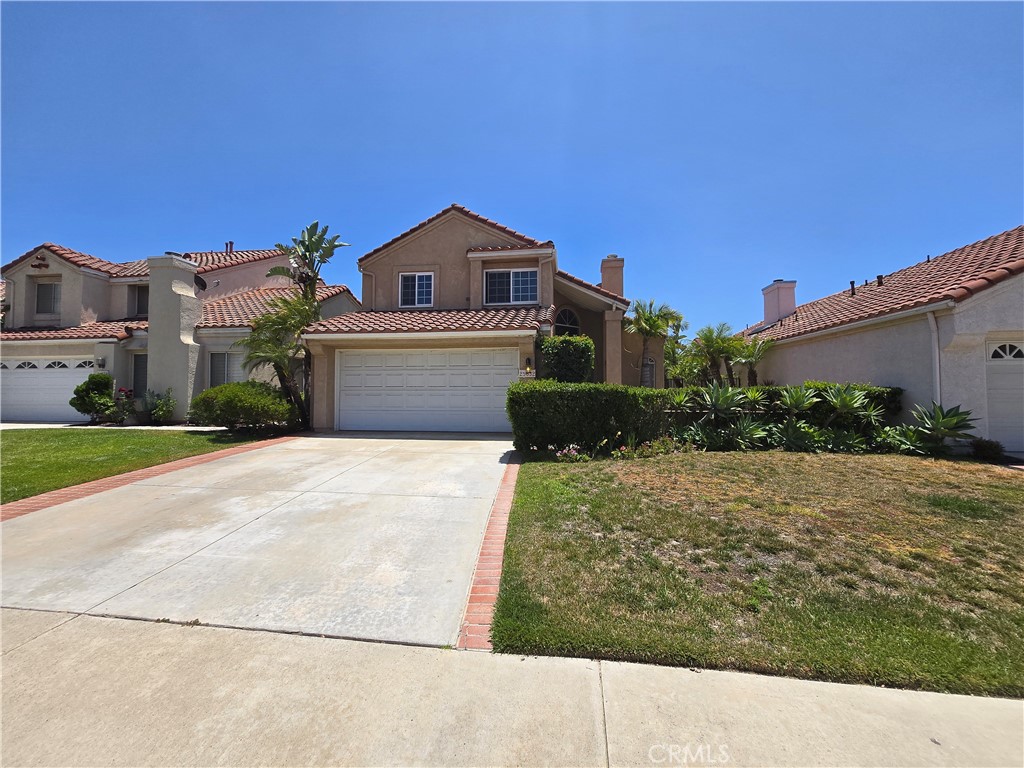Located off the 91 Freeway, this two story home welcomes you to a private entry courtyard/patio area. There are a total of 3 bedrooms and 2.5 baths and the home features a formal double door entry to a step down living room with fireplace and dining area. The separate family room is open to the breakfast nook and kitchen with easy access to the rear yard. Downstairs is also a 1/2 bath and laundry area. Upstairs are two secondary bedrooms sharing a hall bath and the master suite with ensuite bath with double sinks, separate walk in shower & toilet and a walk in closet. There is a combination of wood laminate and neutral tile flooring. The kitchen and baths were updated with beautiful travertine walls. Additional updates include crown moldings, upgraded baseboards, Low maintenance rear yard with fire pit and plenty of outdoor space for family gatherings and outdoor dining. Two car garage with built in cabinets. Located in Villa del Rio HOA with low monthly dues of $46 paid quarterly.
Home has been priced with repairs needed in mind… Call agent for SMALL list of items.
Located in the award-winning Bryant Ranch Elementary School, Travis Ranch Middle and Yorba Linda High School! Brush Canyon Park is walking distance with picnic tables, playing fields, tennis courts, basketball courts, and pickleball. The Santa Ana River trail is great for walking, running, and cycling!