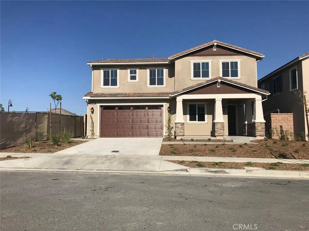 Welcome to this beautifully updated 4-bedroom, 3-bath home in the desirable gated community in North Fontana. Located in the top-rated Etiwanda School District and near freeways, parks, dining, and shopping, this home offers a spacious floor plan with brand-new flooring, fresh paint, a gourmet kitchen with granite counters and island, formal living and dining rooms, a family room, and a downstairs bedroom with a full bath. Upstairs features three more bedrooms, a loft, and a convenient laundry room. The primary suite includes a walk-in closet, soaking tub, dual vanities, and a separate shower. This move-in-ready home is in the master-planned area with amenities like parks, BBQ areas, and play spaces—owner pays for HOA and gardener.
