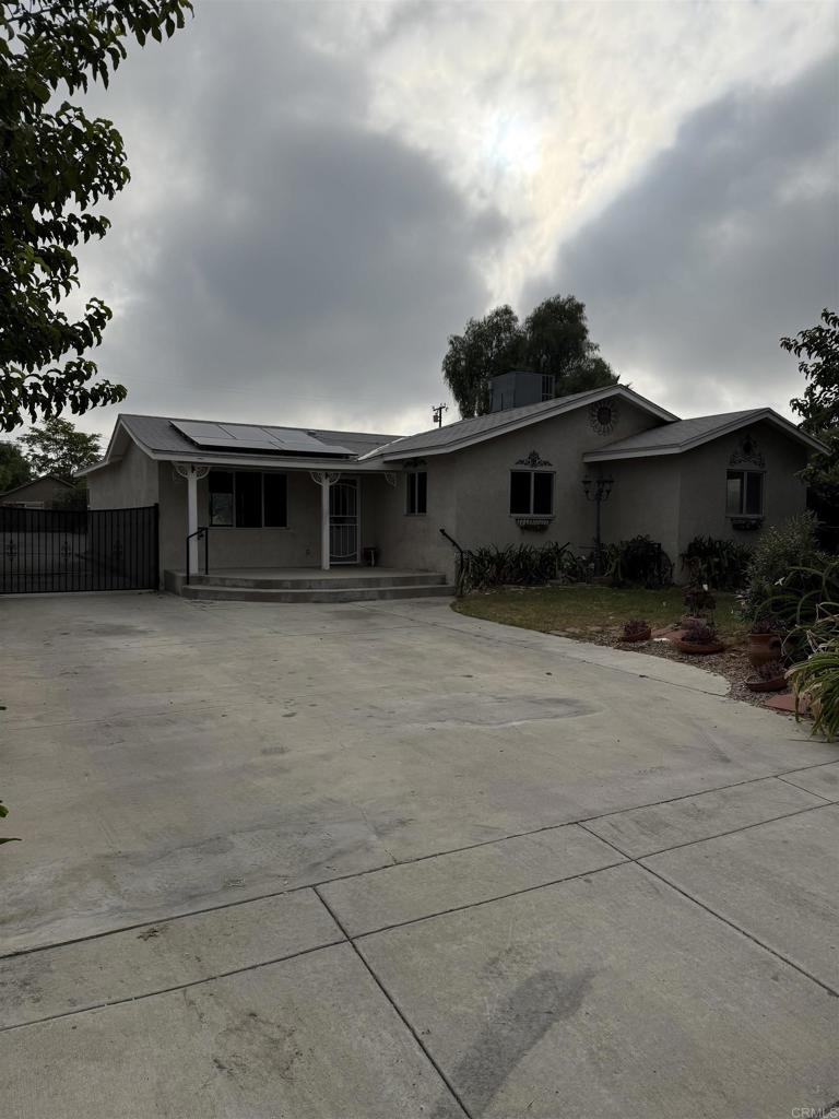 Beautiful home, with a large living room and ceiling mounted surround sound speakers, dual Tiffany ceiling fans, large kitchen with granite counter tops, recess lighting and oak cabinets, separate laundry room/pantry, master bedroom with walk in closet, newer central heating and air, two garages, one with attic storage, long driveway with RV parking all the way to the back of the lot a total of 50 yards of concrete and RV clean out, 40 year roofs were installed in the house and garages. 20 own solar panels.