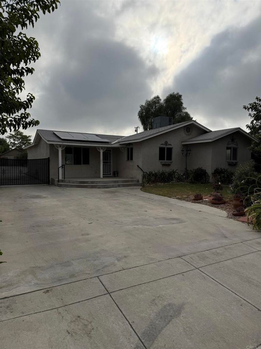 Beautiful home, with a large living room and ceiling mounted surround sound speakers, dual Tiffany ceiling fans, large kitchen with granite counter tops, recess lighting and oak cabinets, separate laundry room/pantry, master bedroom with walk in closet, newer central heating and air, two garages, one with attic storage, long driveway with RV parking all the way to the back of the lot a total of 50 yards of concrete and RV clean out, 40 year roofs were installed in the house and garages. 20 own solar panels.
