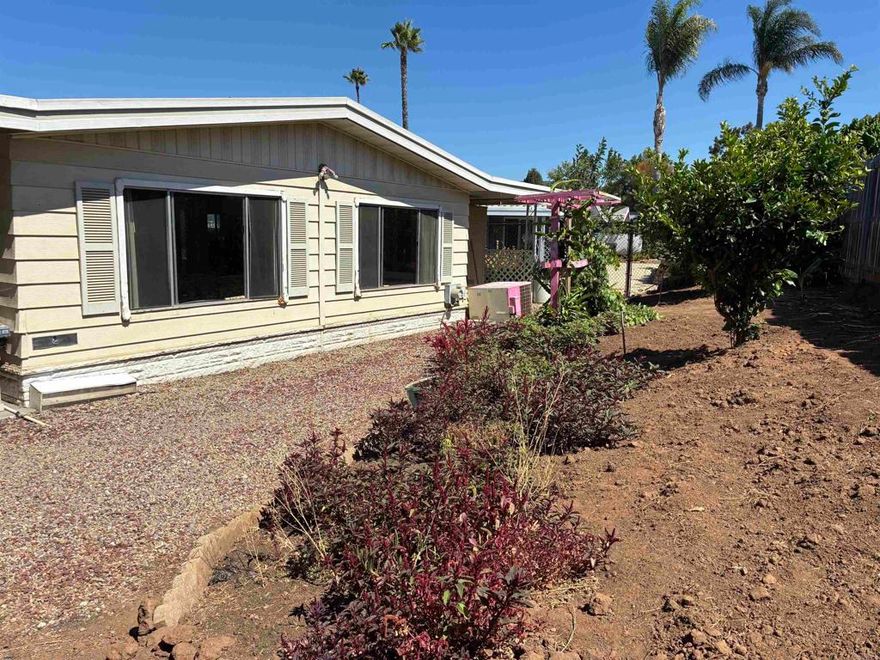 This post HUD home is located in a beautiful 55+ community with many greenbelts and open space.  Live a peaceful and tranquil lifestyle!  Sundance is a beautiful & unique 55+ park that is "ground set" - unlike other manufactured homes, where you typically have to climb up 4-5 stairs into your home, this park has NO entry stairs, meaning a level entry!  This home is still on registration, meaning NO property taxes!  This large 3 section home is located on a cul de sac near the clubhouse, pool and other amenities + guest parking.  The spacious yard offers privacy and space for gardening or projects.  There are a few fruit trees.  Newer roof and floors.  Huge Living room and Family rooms.  Oversized Primary Suite with a dramatic double door entry and ensuite bathroom with double sinks and separate soaking tub and step in shower.  There is also a private ingress/egress to the primary bedroom.  The home does need some TLC and has been priced accordingly but the Seller is also offering a $5,000 allowance for repairs.  Own your own home for LESS than renting an apartment this size.  Land lease is only about $1,900/month. NO HOA FEES.  Sundance is a lovely 55+ community. 2 pets of any size are welcome with prior management approval (breed restrictions apply).  Community Amenities include a Clubhouse, heated Pool, spa, saunas, event space & Kitchen, fitness room, billiards room, library, game room, shuffleboard, multiple green belts.  Conveniently located just minutes away from shopping, dining and entertainment and the Reidy Creek Golf Course.  This home is spacious, happy and bright.  For those seeking Relaxation, Recreation and the Good Life.