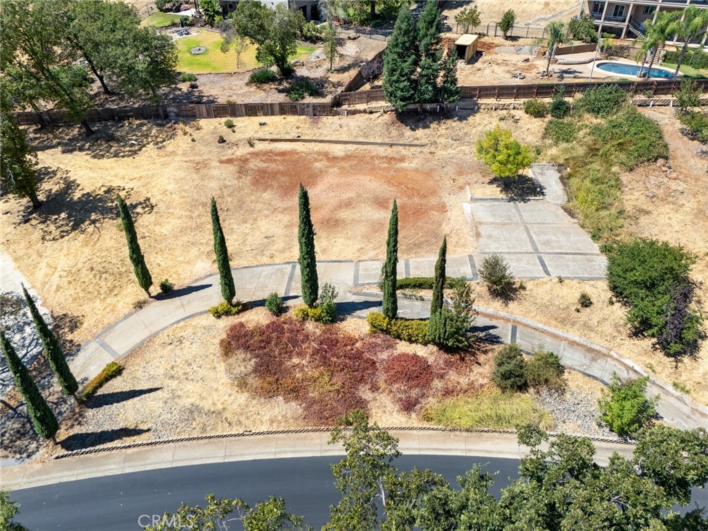 Welcome to 119 Valley View, a premier 1.18 acre lot offering breathtaking views in one of Paradise’s most desirable west-side neighborhoods. With an active PID account, functioning irrigation, and soil prepared for 21 fruit trees, this property is already well-equipped for your plans. Once home to a 2,920 sq. ft. custom-built residence, it still features a level building pad with a concrete circular driveway intact, plus a secondary concrete driveway below. The existing infrastructure provides a strong foundation for future building, making it easier to bring your vision to life. Surrounded by beautiful custom homes and set in a sought-after lower Paradise location, this lot offers the perfect canvas to create a luxurious new home with picturesque surroundings.