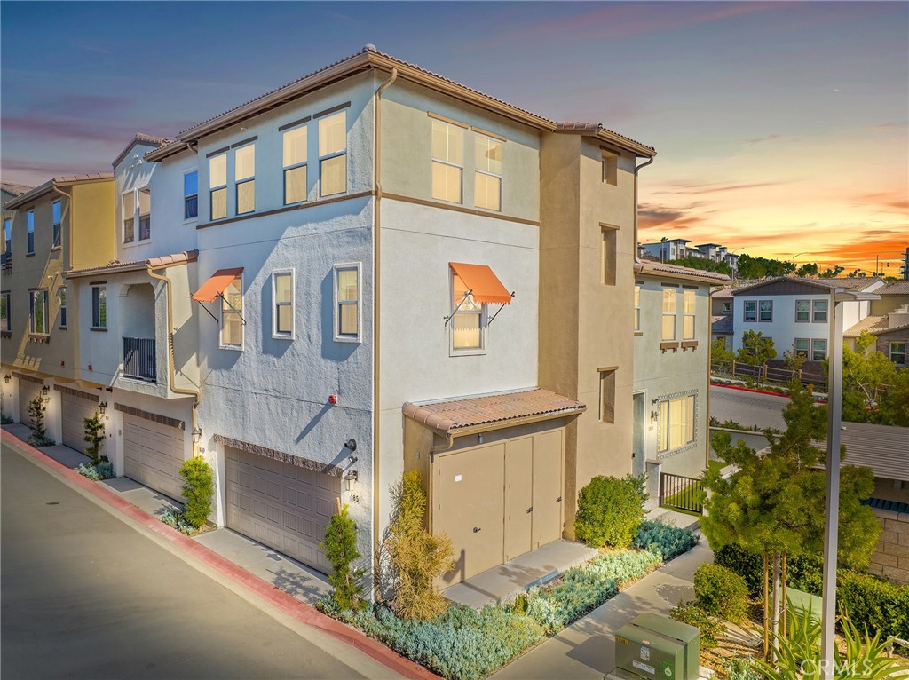 Realize your coastal dreams in the beautiful Oceanside community of Melrose Heights! This stunning Master Planned community of luxury townhomes built in 2022 is your opportunity to live the California dream with easy access to all the best Oceanside has to offer. Take advantage of the beautiful weather and great location in Oceanside with its laid-back beachy vibe. This pet friendly, walkable neighborhood is equipped with generous amenities including a private gated community pool, tot lot, outdoor lounge areas and picturesque landscaping. Imagine weekends strolling Oceanside Pier, art walks, farmer’s markets and seasonal community events. Experience a community filled with families, dog lovers, and dedicated professionals who all share a common love of the Southern California Coastal Lifestyle. As you enter the first level of this corner lot home you’ll walk into a spacious great room with upgraded luxury vinyl plank and an open floor plan filled with natural light from the abundance of windows throughout the living space. Enjoy soaking up the sun on your private patio with easy to maintain turf that extends around the side of the property, amazing for grilling outdoors, curating a custom garden or providing a place for your pets to freely play. Experience your personal Culinary Retreat in the modern open concept kitchen with contemporary led lighting, white quartz countertops and a large island for you to enjoy gathering with friends and family. Smart energy efficient home with paid off solar is equipped with robust EERO wifi boosters, smart thermostat, and EV charger ready attached two car garage. Upstairs all three bedrooms are conveniently located on one level. The luxurious primary suite features white quartz countertops, a walk in shower, an oversized soaking tub, and multiple closet spaces including an oversized 19 foot walk in closet just waiting to house a fabulous shoe and designer purse collection. Ideal layout for all secondary bedrooms with no direct adjoining walls to the primary suite. Dedicated laundry area with ample storage space and plenty of room for full size appliances. As you walk upstairs you'll enter the incredibly versatile bonus loft space great for a movie room, creativity zone, workout retreat or a children's play area. The breathtaking panoramic mountain views and phenomenal sunsets are an extravagant experience you can enjoy daily in your stunning new home. Your Southern California Coastal lifestyle awaits!