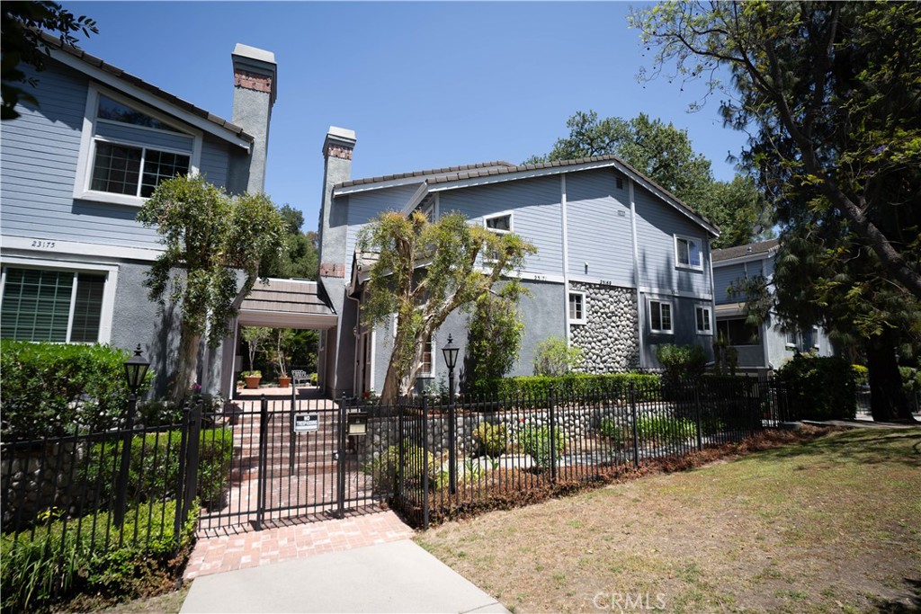 Tucked away in a serene, gated enclave of just six units, this unique and spacious tri-level townhome offers a rare blend of privacy, comfort, and convenience in a coveted Calabasas-adjacent location. Nestled next to a peaceful natural ravine and surrounded by rolling lawns and mature trees, this home feels like a tranquil mountain retreat while being just minutes from The Commons, shopping, dining, and top-rated schools.
Enjoy a private entrance and direct access from the attached two-car garage. Inside, the large living room features a fireplace and opens to a separate formal dining area, perfect for entertaining. The kitchen is complete with a center island, breakfast nook, and a pass-through bar to the cozy den, which includes a ceiling fan and balcony access.
Upstairs, you’ll find two spacious en-suite bedrooms with high ceilings and walk-in closets. The expansive primary suite includes vaulted, beamed ceilings and a luxurious bathroom with dual sinks, a spa tub, and a separate stall shower. Convenient upstairs laundry is located near the bedrooms for added ease.
Light pours in through multiple balconies, and the thoughtful design includes few shared walls, offering exceptional privacy and natural light throughout. Mulholland Meadows boasts stunning curb appeal with lush greenbelt areas and soaring trees, giving the community a resort-like ambiance.
If you’re seeking a peaceful setting close to the heart of the city, this townhome is not to be missed.