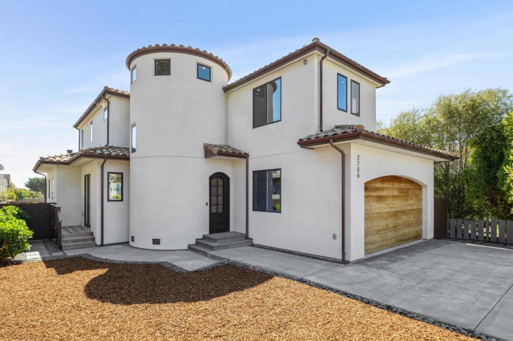 Located in the highly desirable Westside Miramar neighborhood, just moments from the beach and scenic Coastal Trail, this property offers coastal living at its best! This meticulously maintained home features 2,100± sq ft of well-designed space with 4 bedrooms and 3 bathrooms. Step inside to soaring ceilings, European White Oak floors, and custom interior doors. A stunning wood-and-glass circular staircase is the centerpiece of the entryway. The open floor plan flows effortlessly from the high-end kitchen complete with Thermador appliances and ample cabinetry into a spacious living room with a fireplace and out to a private Ipe wood deck, perfect for entertaining and enjoying the ocean air. A ground-floor bedroom and full bath provide flexible living options. Upstairs, the primary suite includes a private balcony, walk-in closet, and luxurious ensuite bath with dual vanities. Two additional bedrooms, a full bath, and a laundry room with sink complete the second floor. Enjoy low-maintenance landscaping, a fully fenced yard, and an attached 2-car garage. With easy access to Hwy 1, this beautiful home offers both tranquility and convenience for drives north to San Francisco and South to historic downtown Half Moon Bay and Hwy 92 for all your Bay Area commutes.