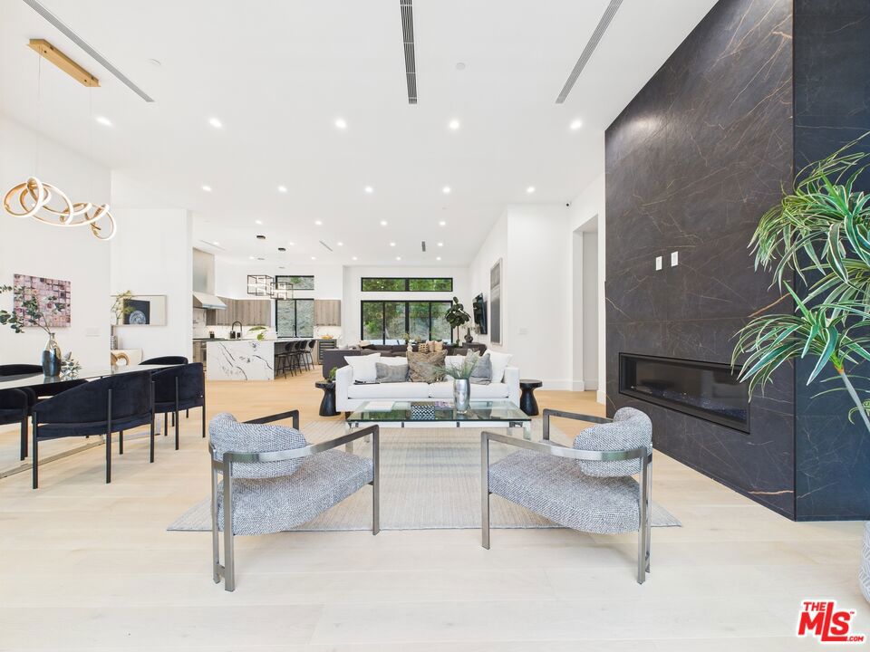Introducing this stunning brand new modern masterpiece, perfectly situated at the end of a quiet cul-de-sac in the hills of Tarzana. This architectural home boasts soaring 12 - foot ceilings, an open and bright floor plan, and breathtaking views from every level.Enjoy seamless indoor-outdoor living with expansive windows and sliding doors that showcase the beautiful surroundings. The private rooftop deck offers panoramic views ideal for entertaining, sunset lounging, or stargazing.This exceptional home offers the perfect combination of privacy, modern luxury, and prime location.