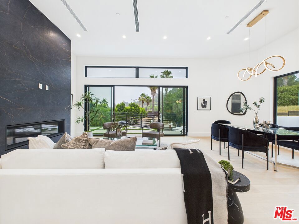 Introducing this stunning brand new modern masterpiece, perfectly situated at the end of a quiet cul-de-sac in the hills of Tarzana. This architectural home boasts soaring 12 - foot ceilings, an open and bright floor plan, and breathtaking views from every level.Enjoy seamless indoor-outdoor living with expansive windows and sliding doors that showcase the beautiful surroundings. The private rooftop deck offers panoramic views ideal for entertaining, sunset lounging, or stargazing.This exceptional home offers the perfect combination of privacy, modern luxury, and prime location.