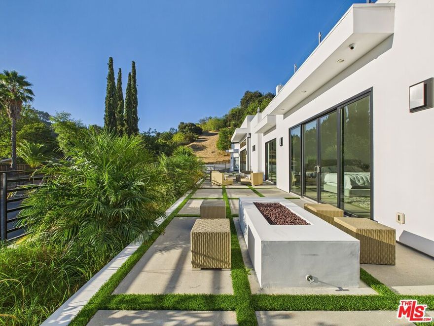 Introducing this stunning brand new modern masterpiece, perfectly situated at the end of a quiet cul-de-sac in the hills of Tarzana. This architectural home boasts soaring 12 - foot ceilings, an open and bright floor plan, and breathtaking views from every level.Enjoy seamless indoor-outdoor living with expansive windows and sliding doors that showcase the beautiful surroundings. The private rooftop deck offers panoramic views  ideal for entertaining, sunset lounging, or stargazing.This exceptional home offers the perfect combination of privacy, modern luxury, and prime location. Must see in person. Views and space far better than photos. Call for your tour today. Pool and spa are conceptual renderings .