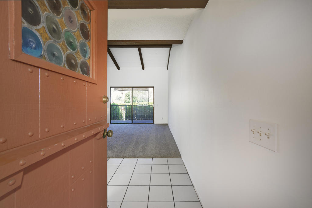 Location, Location, Location! Enjoy the amazing mountain views from this top-floor 1-bedroom condo, in a sought-after gated community. Featuring soaring vaulted post and beam ceilings. The spacious floor plan is perfect. Condo amenities, include a covered carport parking spot, tennis and pickleball courts, a vibrant community room, a fully equipped gym, and a relaxing sauna. Not to mention the 3 heated pools, 2 spas, and BBQ area. The HOA allows short-term rentals with 15-day minimums if city permits are available. Your low HOA fee covers Spectrum cable TV, internet, water, and trash and maintenance of all common areas. Freshly painted and carpeted, this condo is move-in ready. Located close to transportation, shopping, and downtown Palm Springs. Pets welcomed too. Don't miss out on this one!