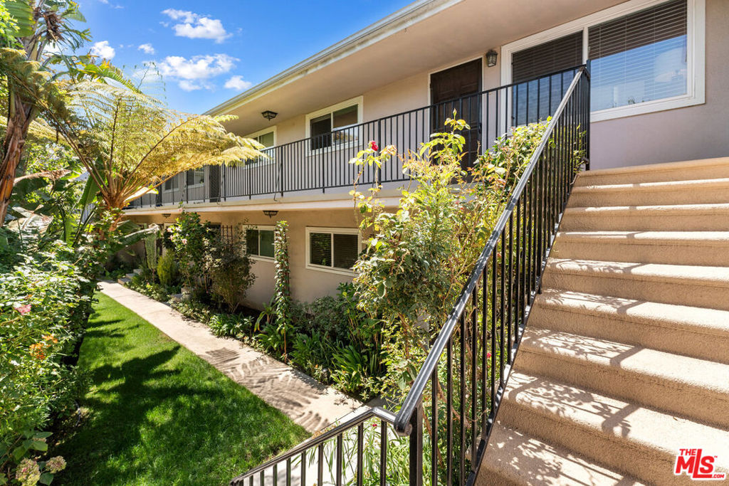 This bright and airy upper-level condo offers the perfect blend of convenience and charm in an intimate garden-style building. Inside, gleaming hardwood floors and soaring vaulted ceilings create an open, spacious feel, while double-pane windows invite in abundant natural light and showcase pleasant views. The beautifully updated kitchen features quartz countertops, high-end cabinetry, a farmhouse sink, and all-new stainless steel appliances ready for your next culinary creation. The bathroom has been tastefully remodeled, and the addition of an in-unit washer and dryer in the hallway brings everyday convenience. With one assigned parking space, HOA dues that include earthquake insurance, and a location just minutes from all that Santa Monica has to offer, this home is as practical as it is inviting.