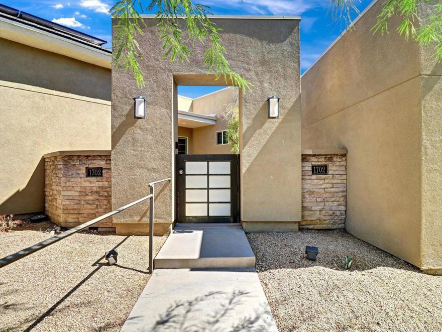 built in 2015, May be the best value for a resort property in Palm Springs.. Over 2500 sq ft.. 3 bedroom, 4 baths (all bedrooms are suites) Large great room with seamless access to enjoy the Resort back yard  with room to build an ADU. Custom pool and spa with 2 covered patios. Spectacular mountain views  with so much space to entertain . Owned solar system, Upgraded powerful A/C units. and a lot more. Property is virtually staged in four pictures