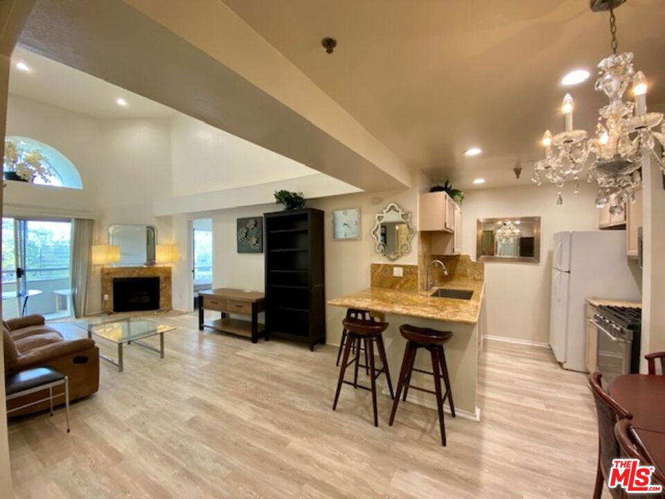 This is a room for rent. Recently renovated 2 bed & 2 bath Penthouse condo unit in prime location! Beautiful layout private bedrooms each side of the living room with newer natural color flooring. Newer kitchen counter has a bar section for breakfast, lots of recessed lights on high ceiling, newer vanity tops and sinks. Powder room is separated from shower. Gorgeous sky scraper view. 2 car garage parking, large storage come with it. furnished, Very convenience to commute anywhere, UCLA Bruin bus stop is across from this building. Walking distance to UCLA village, banks, cafes, restaurant and fitness! Great freeway access. Appointment only for showing.