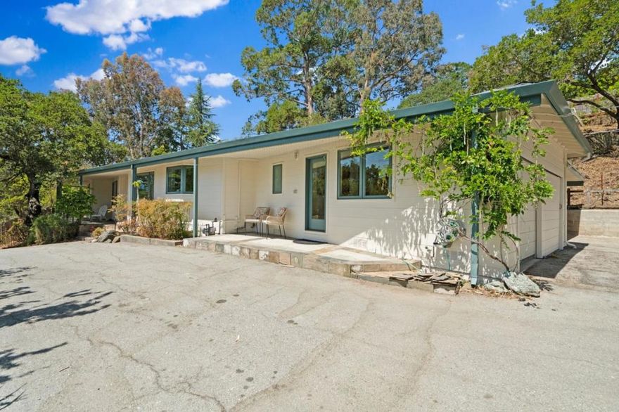 Nestled in the hills of Redwood City, 1780 Edgewood Road offers inspiring views and abundant opportunity on an expansive lot. This unique residence features tile and hardwood floors throughout, a spacious kitchen with exceptional layout, and a primary bedroom with an ensuite bathroom of generous proportions and direct access to a private outdoor area perfect for a transformation into a secluded garden retreat. The hillside setting provides both privacy and mountain vistas, while the lot itself offers ample room for future enhancements such as an ADU, play structure, or sport court. The floor plan, setting, and overall character provide a compelling foundation for thoughtful customization. Complete with a laundry room and multiple en-suite bedrooms this is a residence that invites both immediate enjoyment and long-term vision in a sought-after location.