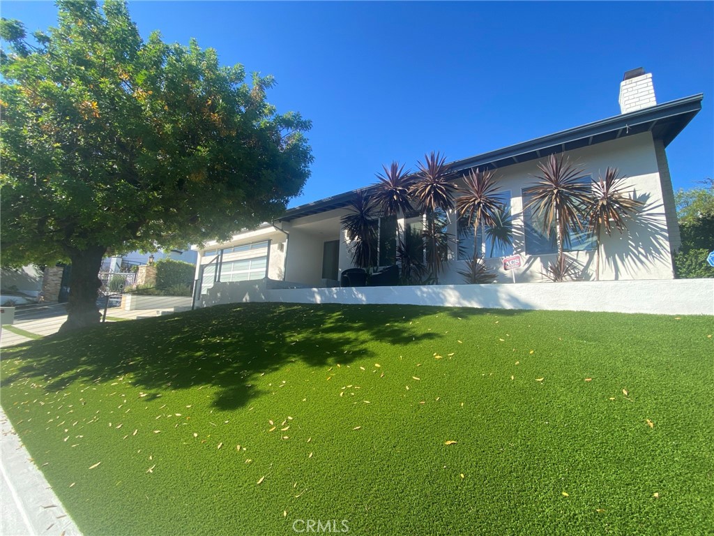 New Lease Listing! Located in the prestigious Royal Woods Community! Heart of Sherman Oaks. 5 bedrooms plus 5 baths of designer ambiance. With 3,718 Square Feet of magnificent living space plus an expansive 11,736 Square Foot lot! Contemporary and modern with VIEWS...VIEWS...VIEWS! Remodeled and spectacular home with walls of glass that bring in beautiful natural lighting! Two fireplaces, Hardwood flooring plus Recessed lighting and smooth ceilings! Gourmet chef's kitchen with Caesarstone countertops plus Stainless Steel Appliances. Perfect center island for not just your eating environment, but the storage space is quite the bonus. Entertain in the lovely dining room that is light and bright! Stroll up the modern stairs and enter pure luxury. Master bedroom is a true suite! Walk in sensational closet with stunning built-ins! Master bath has jacuzzi tub plus step in glass encased oversize shower. A 2nd master suite on first floor leads to a magical yard. Love the walk out deck with tree and mountain views that add to your tranquility! Gorgeous landscaped exterior with large in-ground hot tub. Sliding glass doors abound! A/C! Two car attached garage with direct access. Property is close to all! Easy access to Ventura Boulevard House of Worship, luxury shopping plus dining! Westside is minutes away! Royal Woods Neighborhood 24/7 armed security available.