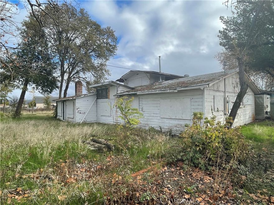 Bring your tool belt and transform this 5.34-acre property with two homes—approximately 1,800 sq. ft. front house and 900 sq. ft. second home—both needing major renovation. Features a private well and vineyard ready for revival. Imagine relaxing in your remodeled home, overlooking your own flourishing vineyard and enjoying your homemade wine.