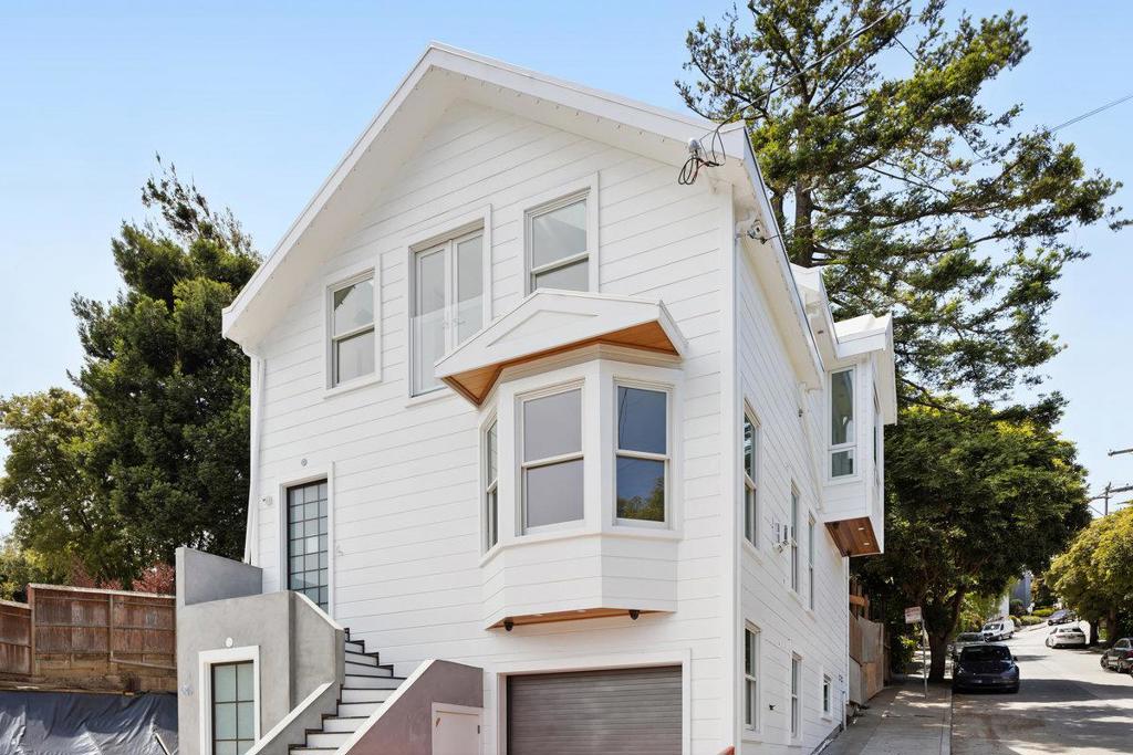 Discover this stunning 4 bed/5 bath brand new remodeled/built home in the heart of Glen Park, offering 2,461 square feet of luxurious living space. This residence boasts 3 spacious ensuite bedrooms, with laundry on the top floor, and a primary bed and full bath on the ground floor with efficiency kitchen area. There is also a 5th full bathroom on the main floor. The main kitchen is a chef's dream, featuring stylish quartz countertops, large island, Sub Zero refrigerator, dishwasher, exhaust fan, microwave, stove and induction stovetop. Enjoy family gatherings in the kitchen/media room combo with luxury white oak hardwood flooring throughout, and cozy up by the fireplace in the living room which also includes a dining area. The home is equipped with radiant floor heating for year-round comfort. Additional amenities include high ceilings on the main floor, vaulted ceilings on the top floor with multiple skylights in bedrooms, bathrooms and hallway and 220 Volt outlet in garage for electric vehicles. Masterfully remodeled from the ground up from electrical, plumbing, 3 tankless water heaters, drywall, lighting, flooring, roofing, high end insulation, all-new windows and doors and a new foundation, ensuring a solid base for generations to come. and more.