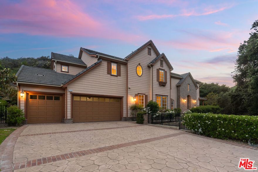 NEW PRICE - Grand Contemporary Estate in Westlake's coveted Majestic Oaks gated community prominently sits at the top of the cul de sac.  Built in 2008, this 2 story,  5 bedroom, 6 bath home boasts an incredible floorplan, abundant square footage, light filled rooms, soaring ceilings, bright windows, formal elegant entry, stunning living room with fireplace, formal dining room, center island chef's kitchen with stainless steel appliances, & large family room with fireplace. Conveniently tucked away off the public rooms is a spacious ground floor bedroom with bathroom ensuite which could be used as a second primary suite or guest quarters. Sun filled study opens to lovely patio surrounded by nature & wrap around grounds with oak trees. Upstairs oversized primary suite is its own luxury lounge retreat, double sided fireplace, balcony, spa-inspired bathroom & spacious walk in closet. 3 additional bedrooms with bathrooms ensuite offer comfort & privacy. The ultimate lifestyle for anyone seeking a quiet sanctuary while minutes from top rated schools, the finest shopping centers, fine dining, outdoor activities, the Four Seasons Spa, and golf courses in Westlake Village.  Enjoy a scenic drive through the canyon to Malibu's world-renowned beaches, wineries, hiking, & equestrian.