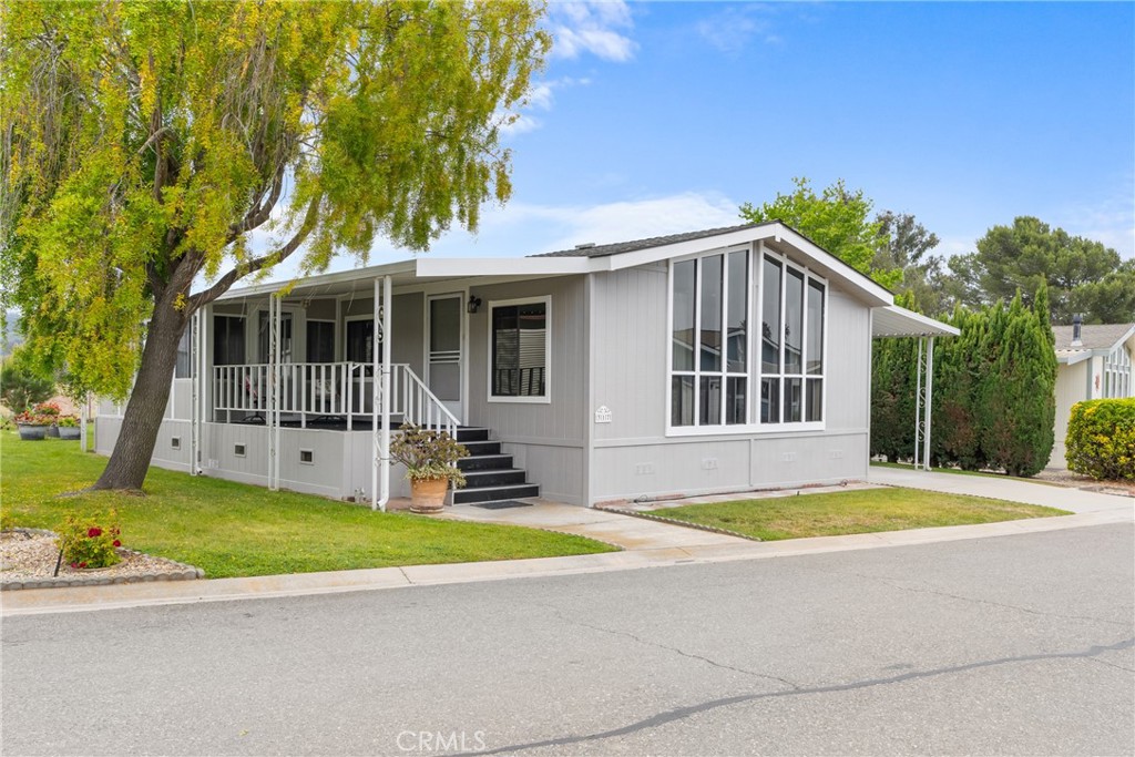 Welcome to 1650 E Clark #317, a beautifully maintained 2-bedroom, 2-bath home located in one of Santa Maria's most desirable communities. This well-cared-for residence features a spacious living room, a dedicated dining area, and a kitchen with a center island that offers an abundance of counter space. You'll also enjoy the convenience of an indoor laundry area, Patio, front porch and sunroom—perfect for relaxing or entertaining year-round. Freshly painted on the exterior and lovingly maintained inside. The primary suite includes a beautifully updated bathroom with a walk-in shower and generous storage. You'll find even more storage throughout the kitchen, hallway, laundry area, and primary bath—making it as practical as it is charming. Enjoy the park amenities which includes a club house with library, pool, spa, and green belt area. Situated in a prime location that backs up to an open space with serene hill views, this property provides a unique sense of privacy with no neighbors behind you. Also conveniently located to shopping, urgent care, fire department and more. Don't miss the opportunity to make this warm and inviting home your own!