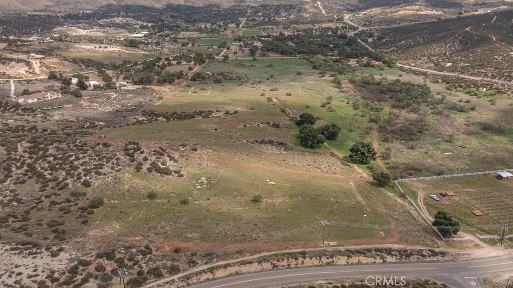 Four 5 Acre Parcels at the end of East Benton Rd and De Portola Road. This property would be a great investment for a family that would like to build a family compound or a developer that would like to build some custom homes.
Parcel 924-130-014 is the first parcel on the map and runs along De Portola this lots has panoramic views and is 4.20 Net Acres and is offered at $476,00 It is not part of this total list price of this listing as it is listed under MLS-SW25110336. The next parcel in is Parcel 924-130-015 contiguous to the first parcel on the map and is 4.98 Net Acres and offered at $525,000.00. The Next Parcel 924-130-016 is 4.87 Net Acres and offered at $510,000.00 and the last parcel is is 924-130-017 and is 5.08 Net Acres and offered at $537,000.00. All 4 parcels are accessible from the easement road at the south end of the properties. All lots have water rights and a house pad location.