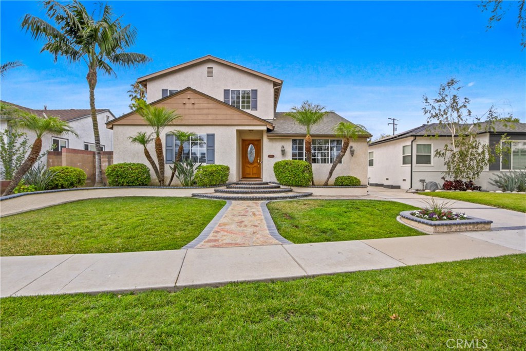 Welcome to this inviting 4-bedroom, 2-bath home nestled on a quiet, tree-lined street in the sought-after Carson Park neighborhood of Long Beach. Offering over 2,000 sq. ft. of comfortable living space, this beautifully maintained home features a freshly painted interior, new wood-like laminate flooring, and central A/C.
The updated gourmet kitchen is a standout, with granite countertops, abundant cabinetry, tile flooring and a cozy fireplace that adds warmth and charm. The spacious primary suite includes a walk-in closet and a remodeled en-suite bath with an upgraded tub and shower.
Step outside to a lush, landscaped backyard—an entertainer’s dream with a private in-ground spa, built-in BBQ island, firepit, and plenty of room to relax. The oversized 2-car garage is a rare find, featuring an overhead lift ideal for car enthusiasts.
Additional highlights include an inside laundry room, terrific curb appeal, and a prime location near top-rated schools, shopping, dining, and freeway access.