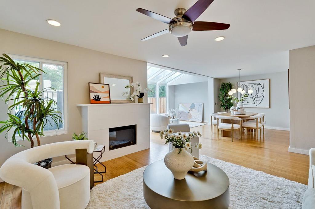Nestled in serene Foothills, stunning De Anza Oaks townhome offers academic distinguished Cupertino schools: Monta Vista High, Kennedy Middle and Stevens Creek Elementary. Enclosed, private courtyard leads to a spacious, open floor plan ideal for modern living and entertaining. Elegant living and dining room features a fireplace, ceiling fan, new light fixture opens to a solarium with attractive glass windows that provides natural light and direct access to the large backyard deck. The chef kitchen is complete with quartz counter tops, backsplash, stainless steel appliances, dining area, window showcases serene exterior view, abundance of storage cabinets and drawers ensuring culinary delight. The primary suite features vaulted ceiling, walk-in shower with frameless shower door, updated light fixtures, tile floor. Well-proportioned secondary bedrooms, each offers mirrored closet door, recessed lights and ceiling fan. Inside laundry area with washer and dryer. Attached two car garage. Outstanding neighborhood amenities include a gated entrance, spacious clubhouse, green belt, gated junior Olympic size pool and children's pool, guest parking and playground. Convenient location, close to Rancho San Antonio hiking trails, shoppings, groceries, and easy commutes to local employers.