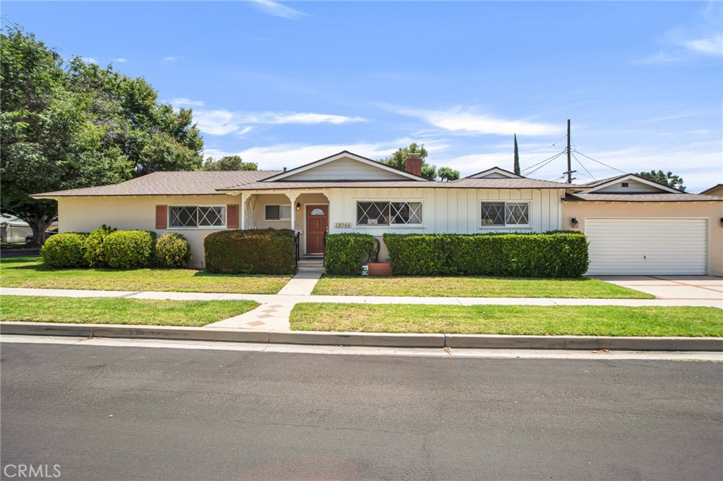 Set on a prominent corner lot in a sought-after Northridge neighborhood, this inviting single-story home offers over 2,100 square feet of comfortable living space on a lot of approximately 7,500 square feet. With 4 generously sized bedrooms and 2 baths, the layout is functional and full of promise for future customization. The formal living room showcases a classic stone fireplace tucked into the corner, lending character and warmth. The kitchen provides a central hub and connects to a formal dining room that opens directly to the backyard through sliding glass doors—ideal for hosting gatherings. Adjacent to the dining area, a sunken family room features dramatic wood-beamed cathedral ceilings and a second set of sliding doors, enhancing indoor-outdoor flow. A laundry room is conveniently located off the kitchen with access to the side yard. The primary suite includes its own 3/4 bath, while the secondary bedrooms share a well-appointed full hallway bathroom. An attached 2-car garage offers additional room for storage. Outside, a large, covered patio anchors the backyard, with ample open space for entertaining, play, or gardening. With a little vision, there’s potential to open up the floorplan and transform this lovingly cared-for home into a modern masterpiece. Located within the boundaries of well-regarded Calahan Street Elementary and Grover Cleveland Charter High School, the home is also moments from major conveniences like Costco, Whole Foods, and Target, and is near Northridge Fashion Center for retail and dining. Local recreational options abound with nearby Dearborn Park and scenic hiking at Limekiln Canyon, and commuters will appreciate easy access to the 118 and 405 freeways, connecting you effortlessly to all corners of the Valley and beyond.