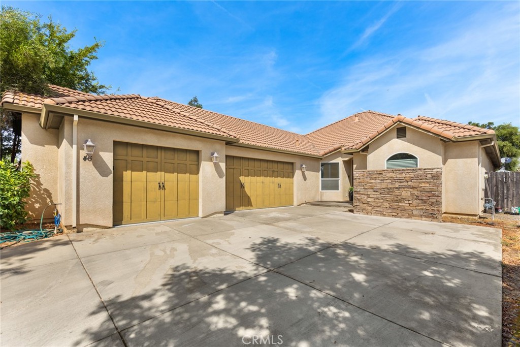 Welcome to this beautifully designed 3-bedroom, 2-bathroom custom home with a 3 car garage, located on a quiet cul-de-sac. Situated on the largest lot on the street, this property offers privacy, space and endless potential--including room for boat parking on the side of the home. Step inside to find gorgeous wood flooring throughout, elegant plantation shutters, and high ceilings that create a bright, open atmosphere. The home features wainscoting in the entryway, adding a touch of timeless charm. The expansive great room seamlessly connects the living, dining and kitchen areas, making it ideal for entertaining. The spectacular kitchen boasts granite countertops, a large island with seating, and ample cabinetry--perfect for the home chef. The adjacent living room features a striking fireplace and opens directly to the covered patio, ideal for indoor-outdoor living. Retreat to the master suite, which includes a spacious bathroom with dual closets, soaking tub, and a separate shower. Treat yourself and come see this gorgeous home.