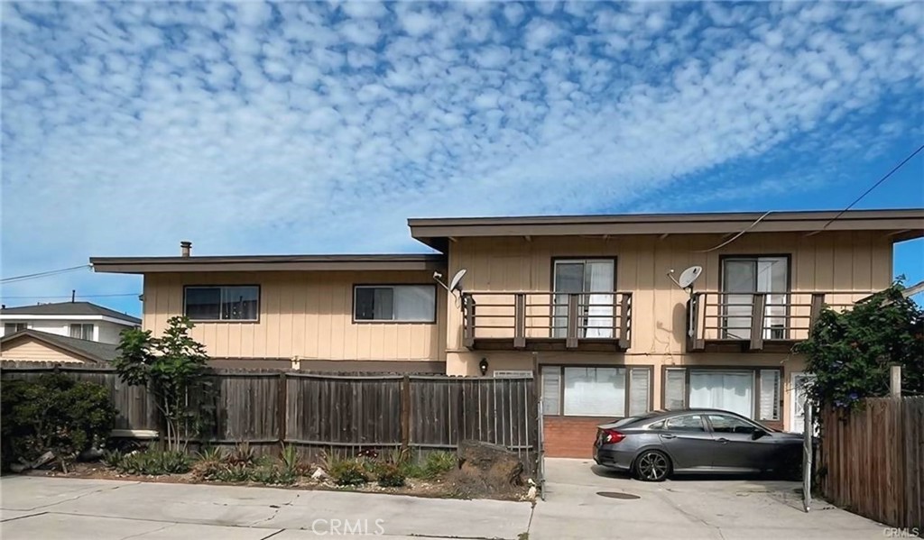 Unique income opportunity with FOUR REVENUE STREAMS and RECENT UPGRADES! Four units: built in 1921 single-family residence (2 BR/1 bath) AND built in 1980 two townhouses (2/1.5) and an apartment (2/1). Amazing location on a quiet street near the 110 and PCH. Equidistant from the water in three directions and the 405 in the other! Excellent privacy with window separation from neighbors. Newer laminated flooring throughout (except for retaining the hardwood floors in the single-family living room). Long list of major improvements include two new bathtubs with shower doors and tile walls, all three water heaters on the property, two dishwashers and one furnace. Plus-level elementary school and high school are less than a mile away. Great access to everything you need--shops, restaurants and an array of financial and medical facilities! There is truly great convenience here in an updated, multi-faceted package!