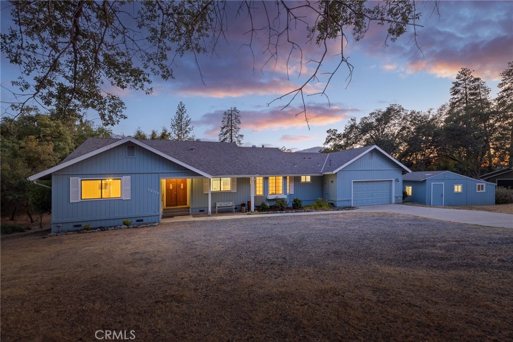 PARK SETTING and oh so many features! A bonus shop, storage, hobby room and so much more! This beautiful well maintained 3 bedroom 3 bathroom home sits on just over 2 USABLE ACRES on a quiet street in Oakhurst, just MINUTES FROM BASS LAKE and the SOUTHGATE OF YOSEMITE NATIONAL PARK. Walking through the double door entrance you will immediately be embraced by the natural lighting, the spacious updated kitchen, large dining area with BEAUTIFUL VIEWS OUT OF EVERY WINDOW! The large open living room features a woodstove, wet bar, and sliding door out to the expansive deck, perfect for quiet evenings or entertaining guests. The extra room off of the deck is perfect for any hobby, plenty of storage, and it has it's own mini split to make sure you're comfortable while you work or study. In addition to this, there is also a wood shed/work shop PLUS a SHOP, plus a Connex/Sea Train container for storing your ATV's or other toys or tools.