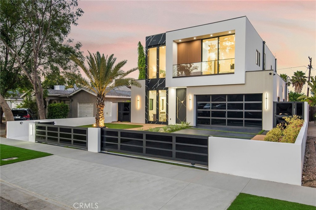 Welcome to a sanctuary of modern luxury, an architectural masterpiece designed for
discerning homeowners who appreciate the finest details. This stunning property
features fine wooden floors flowing throughout, complemented by elegant European
features. Step through the grand entrance to be greeted by a majestic staircase,
adorned with large quartz panels and smart LED lights. Each room in this exquisite
home leads to the most elegant and sophisticated bathrooms imaginable, showcasing a
distinguished taste for refined finishes. The main room is anchored by a spectacular
fireplace, framed by a gigantic quartz stone. This flows seamlessly into a living area
featuring a wine cellar that embodies artistic opulence. Subtle connections lead to a
chef’s dream kitchen, equipped with the most sophisticated appliances on the planet. A
second living space offers a refreshing contrast, perfect for indulging in freedom. Enjoy
a drink at the bar, challenge friends on the pool table, or break a sweat in the gym
before gazing at the stars in the dedicated room.
Modern pocket doors seamlessly connect this space to a sparkling swimming pool with
a Jacuzzi, creating the ultimate entertaining haven. Features throughout the home
include speakers wired throughout the entire home, including in the pool/Jacuzzi area, a
modern security system, WiFi extenders throughout the home, Apple iPad tablets to
control home systems, and two AC units for optimal climate control. This property also
includes a brand new second living space, perfect for guests or extended family.
Experience the pinnacle of luxury living in this extraordinary home, where every detail
has been meticulously crafted to offer a lifestyle of unparalleled elegance and
sophistication.