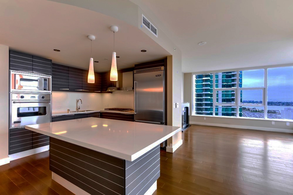 PRIME SOUTH WEST VIEWS AT BAYSIDE! Perfect 2 Bed Den layout, two full baths with two balconies. This home has 1404 sq. ft. with stunning bay and city views. Finishes are dramatic and striking emphasizing a contemporary design aesthetic. Unit 2102 is equipped with a chef inspired kitchen lined with imported Snaidero cabinetry and beautiful stainless Viking appliances giving it a clean crisp fresh approach to preparing meals. **WALK SCORE OF 91 - Walker's Paradise*** SNAIDERO CABINETRY DIRECT FROM ITALY, VIKING AND MIELE APPLIANCES. Common Areas include Stunning Pool & Spa, Residence Social Lounge (With pool table), Sauna, Steam Room, Fitness Center, Theater, Conference Center, Wine Tasting Room and Library. The concierge service and 24-hour security add a sense of belonging while an ambiance of refinement and contemporary sophistication is apparent throughout the building. Bayside is steps from the vibrant neighborhood of Little Italy with a multitude of shopping and dining options. Bayside is located on the "Residential Front Row" at the North Embarcadero overlooking San Diego Bay and Coronado. This incredible location provides the ultimate in sunset, bay and ocean views. Life at Bayside is simply a testament to living life without compromise with amenities that rival the finest 5-star hotels. Whether enjoying Bayside's Movie Theater Screening Room or relaxing with your favorite glass of Cabernet in the wine tasting room, life is good at Bayside. Neighborhoods: COLUMBIA Complex Features: ,,,,,,,,, View: City,Evening Lights,Panoramic Ocean