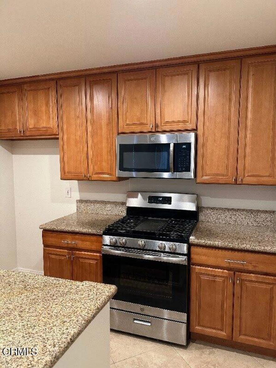 Welcome home to this beautifully updated two-bedroom, two-bathroom corner-unit condominium located in the desirable Los Olivos community of La Mirada. Boasting approximately 973 square feet of living space, this light-filled, two-story floor plan offers a comfortable and contemporary lifestyle. Zillow+2Redfin+2As you step inside, you'll find an inviting open living area with large windows that provide plenty of natural light and a sense of spaciousness. The adjacent kitchen features rich wood cabinetry, sleek granite countertops, and stainless steel appliances -- making meal preparation a breeze. Redfin+1Upstairs, you'll discover two generously proportioned bedrooms, both with high ceilings and ample closet space. The primary suite includes an updated full bathroom with modern fixtures and finishes. Redfin+1This unit stands out with wood-laminate and tile flooring throughout, central air and heat, recessed lighting, and the advantage of having no one above you, offering both privacy and quiet. Redfin+1Residents of the Los Olivos community enjoy a resort-style setting with amenities including a swimming pool, spa, tennis courts, clubhouse, and fitness center. RedfinConveniently located near shopping, dining, recreation, and major freeways, this turnkey condominium provides a terrific opportunity for first-time buyers or anyone looking to downsize without compromising on style and comfort.