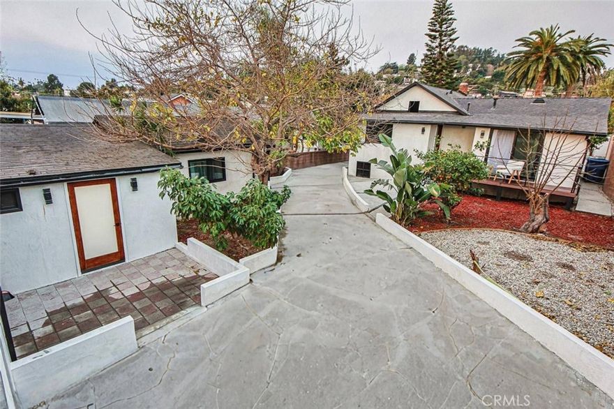 Charming, Move-In Ready Duplex in Franklin Hills — 1321 & 1323 Sanborn!
Rare two-house compound in the coveted Franklin Hills pocket of Los Feliz. Situated on a 6,700 sq. ft. lot, this detached duplex offers privacy and income potential: a front house with 3 bedrooms and 2 bathrooms, and a back house with 2 bedrooms, a bonus room and 1 bathroom. Each unit has its own gas meter and electrical panel, making this an ideal owner-occupier property with rental upside or a turnkey investment.

Highlights
- Thoughtfully renovated throughout: new hardwood flooring, fresh paint, updated light fixtures, new kitchen cabinetry with quartz countertops, and remodeled bathrooms.
- Comfort upgrades include mini-split AC/heaters and updated stucco exterior.
- Private, landscaped yard with mature trees creates a serene, garden-like setting perfect for relaxing or meditation.
- Extended concrete driveway, 2-car garage plus additional parking.
- Rooftop deck above the garage with views of the Hollywood Hills — on clear days you can spot the Hollywood sign.
- Prime location: steps from Los Feliz dining and shopping, with easy access to the nightlife and boutiques of Silver Lake and Hollywood.
Ideal for buyers seeking a comfortable primary residence with rental income potential. A well-maintained, turnkey property.