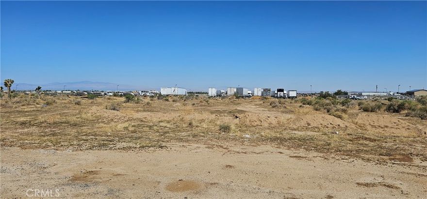 This exceptional property located in the thriving City of Lancaster, California, where prime location meets potential. This 5 acre Vacant Land parcel boasts City of Lancaster Light Industrial Zoning, making it an ideal investment opportunity for entrepreneurs and businesses seeking a strategic foothold in the region. The property's geographical advantage cannot be overstated. Its proximity to Highway 14/Exit Avenue M, provides seamless connectivity to major transportation arteries, ensuring easy access for both customers and suppliers. This strategic location ensures your business is well-connected not only within Lancaster but also to the greater Los Angeles area, enabling efficient logistics and distribution. Situated just north of the renowned Michael Antonovich Courthouse, this property benefits from the thriving local economy and a steady flow of visitors to the courthouse. Numerous businesses in the area thrive due to this courthouse's presence, making it an ideal environment for synergy and growth. The Light Industrial Zoning designation of this property unlocks many possibilities allowing for various business activities, including trucking, manufacturing, warehousing, distribution, research and development, assembly, and more. Whether you're a start-up looking for room to grow or an established corporation seeking to expand your operations, this zoning accommodates a wide range of uses to suit your needs. Beyond its location and zoning benefits, this property is surrounded by a range of amenities that enhance the quality of life for both employees and residents. Lancaster, known for its vibrant community and strong local economy, offers a variety of dining, shopping, and entertainment options. The Antelope Valley Mall, just a short drive away, provides a shopping and dining hub for both business and leisure. Less than 1 mi from the mega Trader Joes warehouse center.