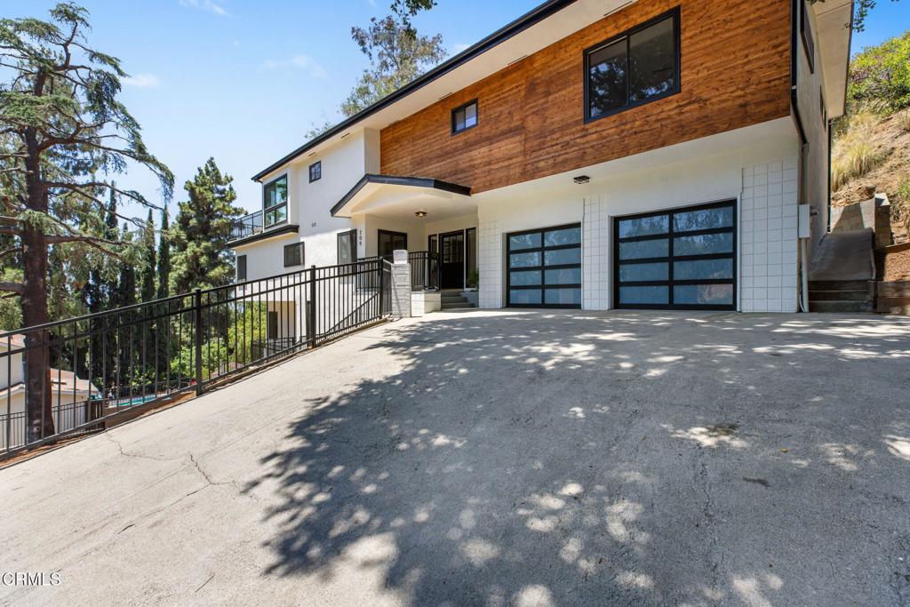 Welcome to 709 Wilson Ct -- a beautifully remodeled home perched on a spacious double lot with sweeping views of Burbank. This stylish residence offers the perfect blend of comfort, functionality, and modern design in one of the city's most sought-after neighborhoods. Step inside to discover a bright, open layout featuring a completely updated interior, including new finishes, flooring, and fixtures throughout. The primary suite is a true retreat, complete with a walk-in closet, private balcony, and a sunroom that captures natural light and city views. The expansive backyard offers endless potential for entertaining, gardening, or future expansion. Tucked away on a quiet cul-de-sac yet just minutes from Burbank's vibrant shops, dining, and studios, this home is a rare opportunity to enjoy modern living with space, privacy, and unbeatable views.
